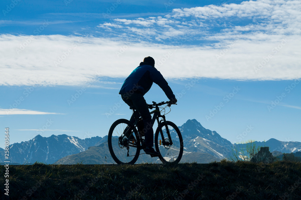 Cyclist against Mountain Landscape