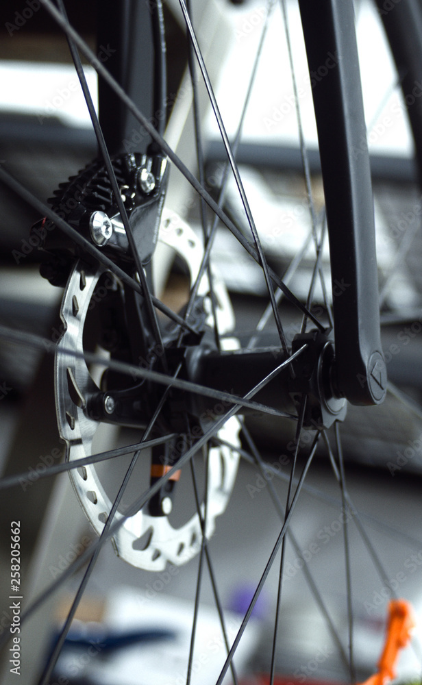 Obraz premium Closeup of front bicycle wheel, hub and spokes of road bike