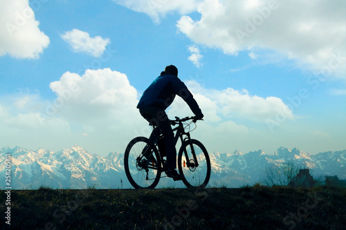 Cyclist against Mountain Landscape