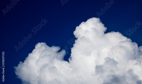Blue sky with clouds forming drawing in the sky, natural nature