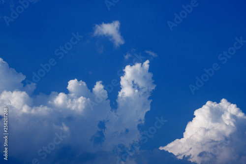 Blue sky with clouds forming drawing in the sky, natural nature © Anderson