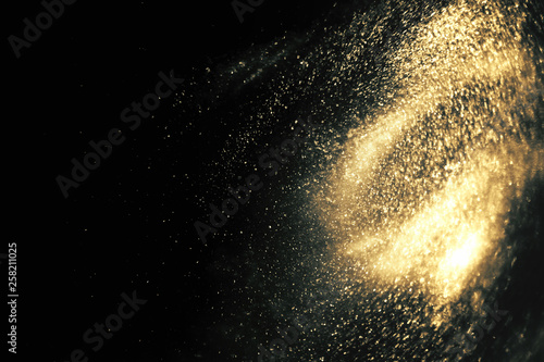 Abstract black and gold festive glitter shimmering magic luxury background with copy space. de-focused