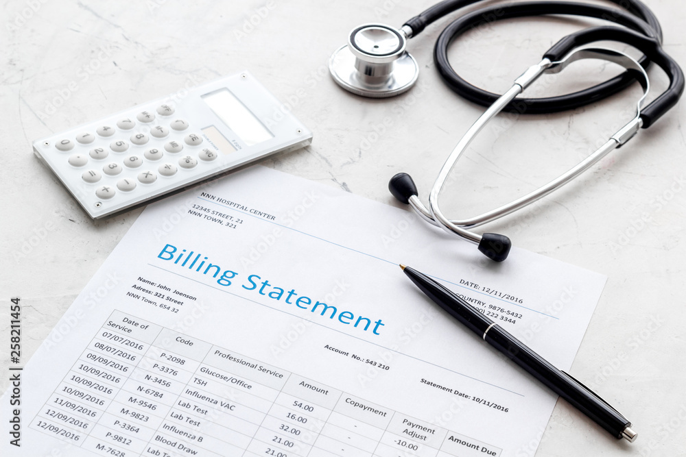 medical treatment bill, calculator and phonendoscope on white background medical treatment bill, calculator and phonendoscope on white background