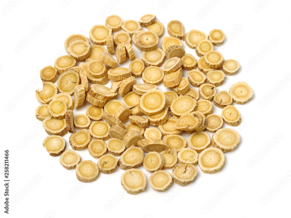 Chinese Herbal medicine - Astragalus slices, Huang Qi (Astragalus propinquus) on white background Chinese Herbal medicine - Astragalus slices, Huang Qi (Astragalus propinquus) on white background