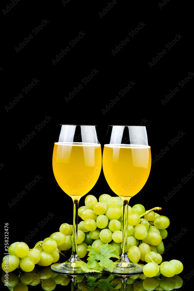 Glass of wine and grape on black background Glass of wine and grape on black background