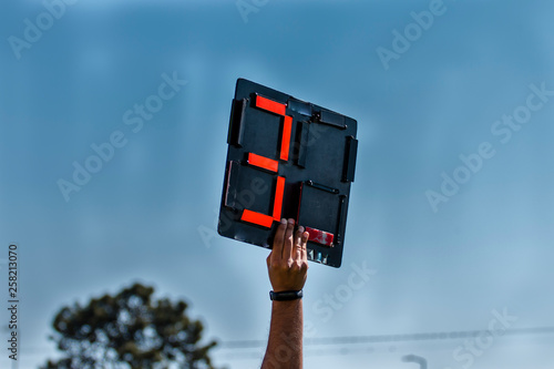 Obraz na płótnie Assistant Football referee shows extra time