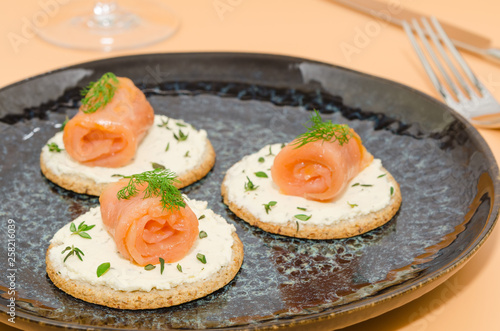 Canapes with smoked salmon. Canapes with cheese, dill and salmon  photo