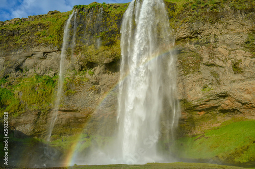 iceland waterfall seljalandsfoss, double waterfalls with rainbow 