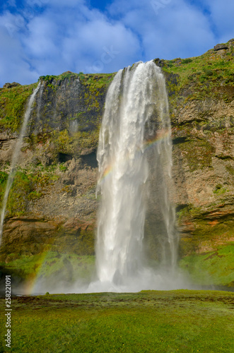 View of waterfall seljalandsfoss in Iceland during a warm summer day.