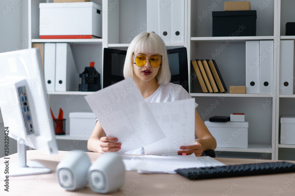 young beautiful woman work in office sit at table sort pile of document young beautiful woman work in office sit at table sort pile of document
