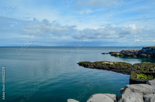 Rocky outcrop going into the Ocean water, Iceland © JMP Traveler