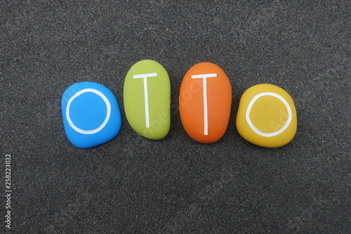 Bild auf Leinwand Otto, masculine given name composed with multi colored stones over black volcani