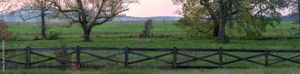 Hazy panoramic sunset at an Alabama pasture Hazy panoramic sunset at an Alabama pasture