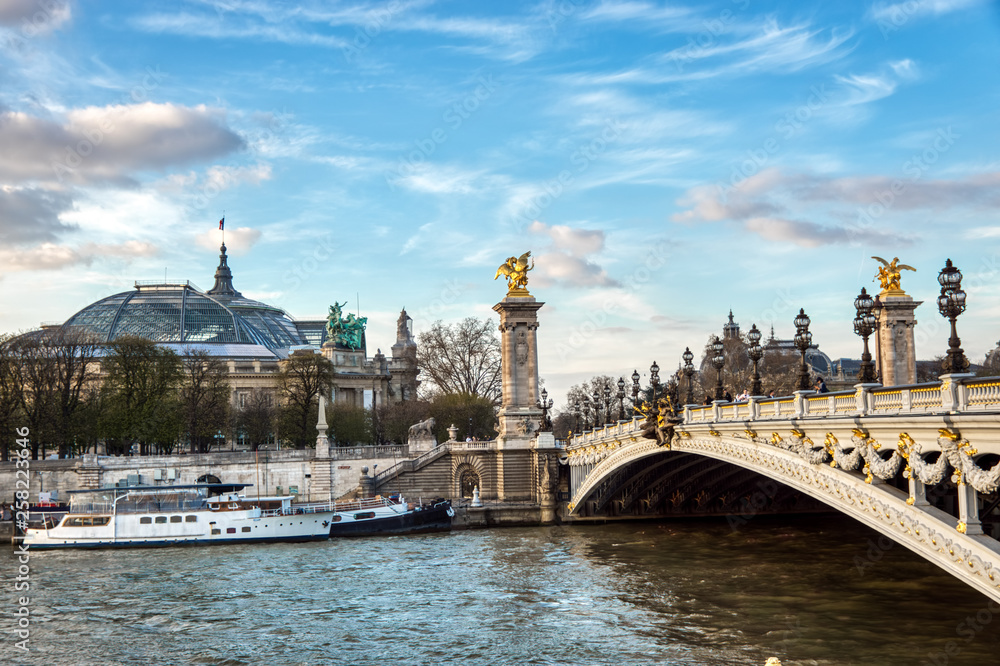 Pont Alexandre III on Seine River with Grand Palais and Petit Palais in background - Paris France Pont Alexandre III on Seine River with Grand Palais and Petit Palais in background - Paris France