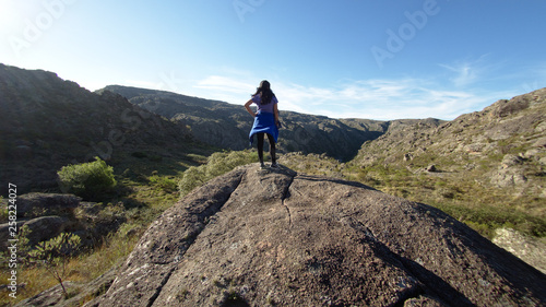 A hiker at Cerro Blanco reserve, near Tanti and Los Gigantes in the Altas Cumbres region, Cordoba, Argentina. photo