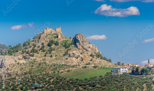 Moclin medieval walled town and ruined castle with blue sky aerial panorama
