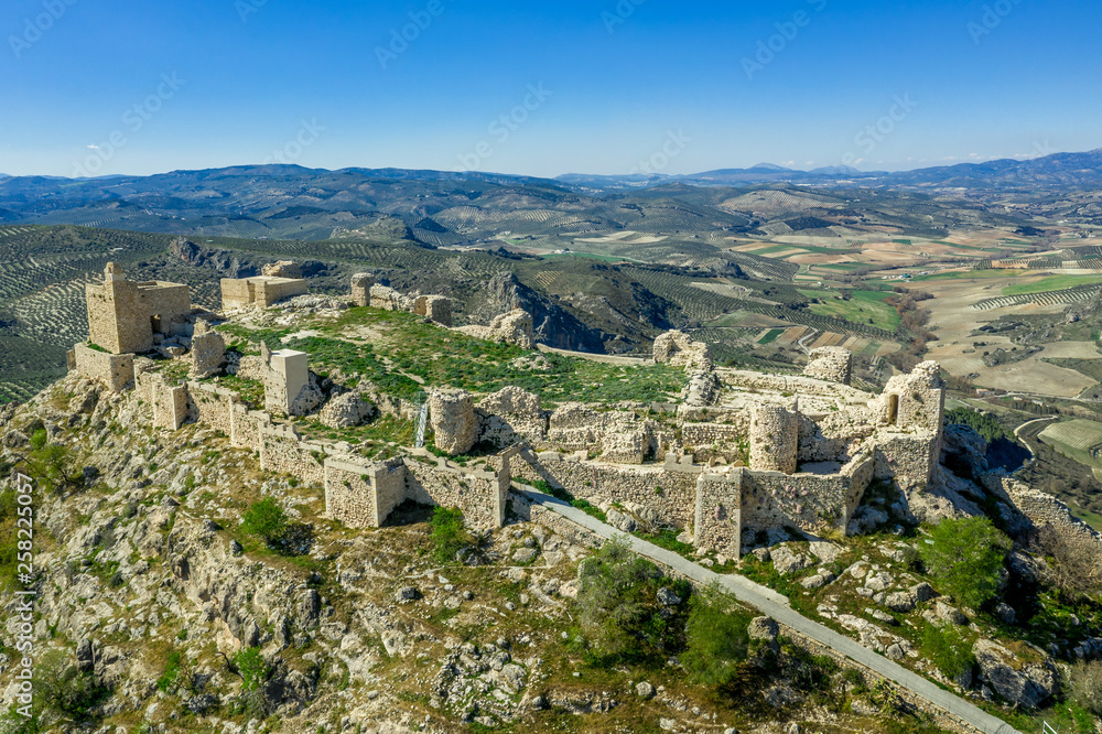 Moclin medieval walled town and ruined castle with blue sky aerial panorama