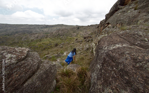 A hiker at Cerro Blanco reserve, near Tanti and Los Gigantes in the Altas Cumbres region, Cordoba, Argentina.