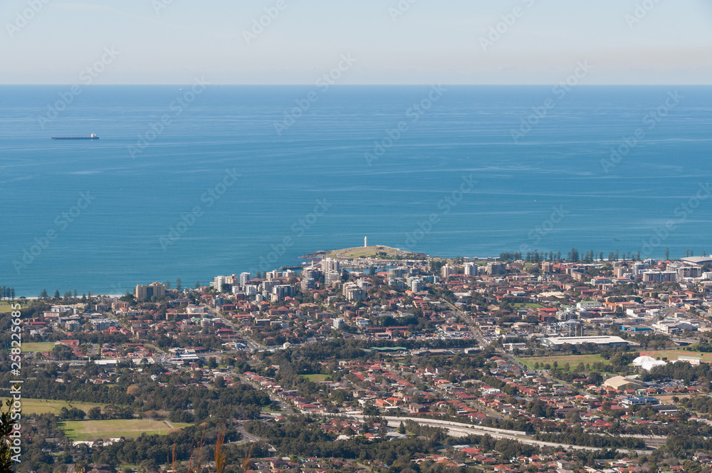 Aerial view of Wollongong city centre with lighthouse landmark on hill