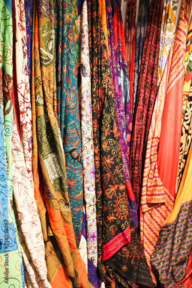 Color scarves vertically hanging in the Indian market.