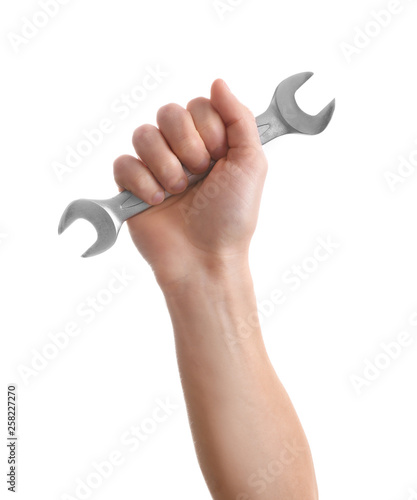 Man holding wrench isolated on white. Construction tools