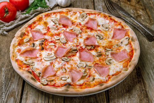 Pizza with ham and mushrooms