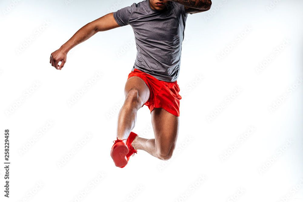 Jumping man wearing stylish and comfortable sportswear - obrazy, fototapety, plakaty 