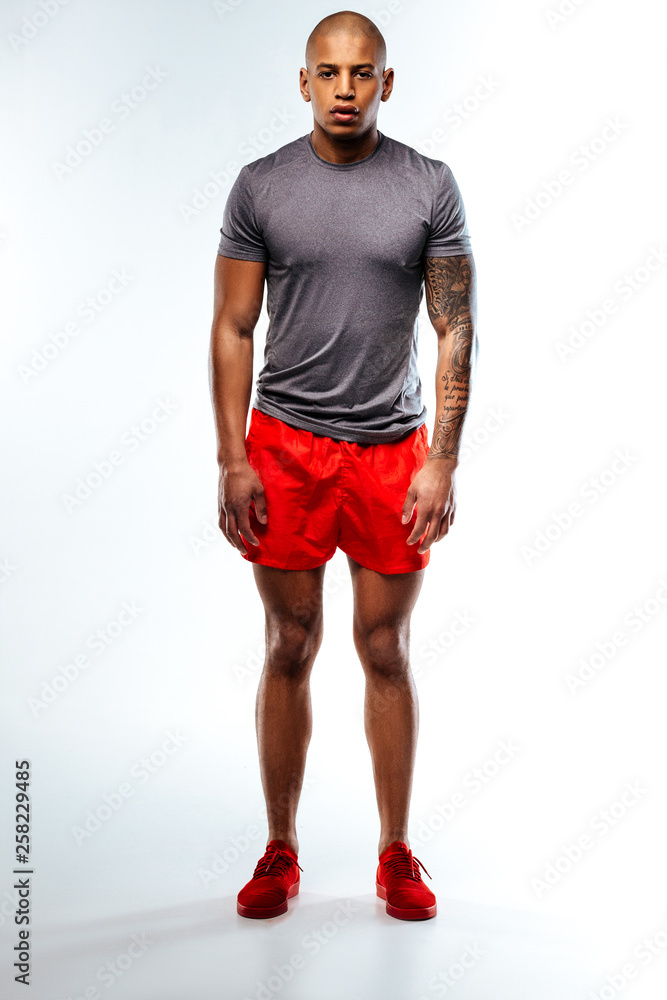 Athlete wearing red and grey summer sport suit Athlete wearing red and grey summer sport suit