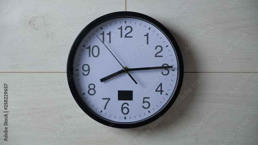 Time lapse of a big clock on a white wall. Time lapse of a big clock on a white wall.