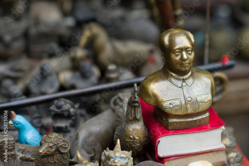 Photography Pingyao, China - 08 13 2016: Vintage and old Chinese Bronze Great Leader Mao Zed