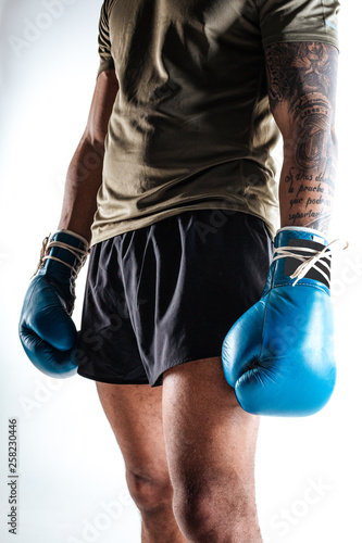 Boxers sportive figure with blue boxing gloves © zinkevych