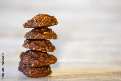 Stack of five no bake cookies on marble counter top