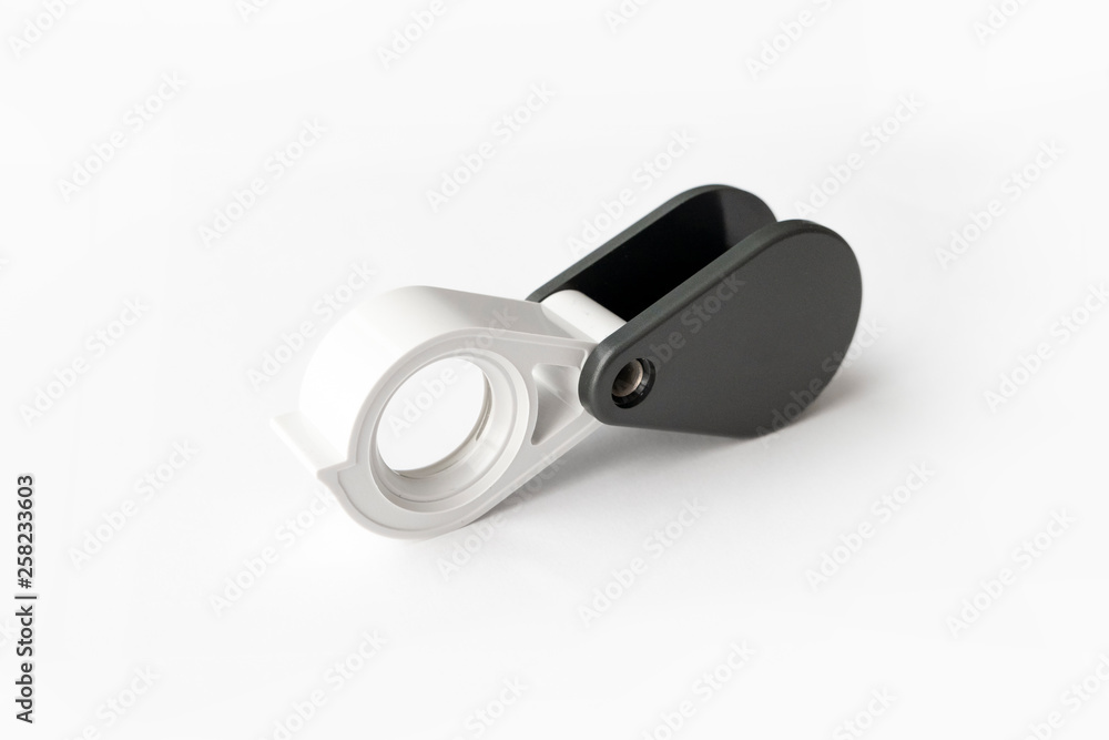 Magnifying glass for diamonds or see the amulet Isolated on a White Background. Magnifying glass for diamonds or see the amulet Isolated on a White Background.