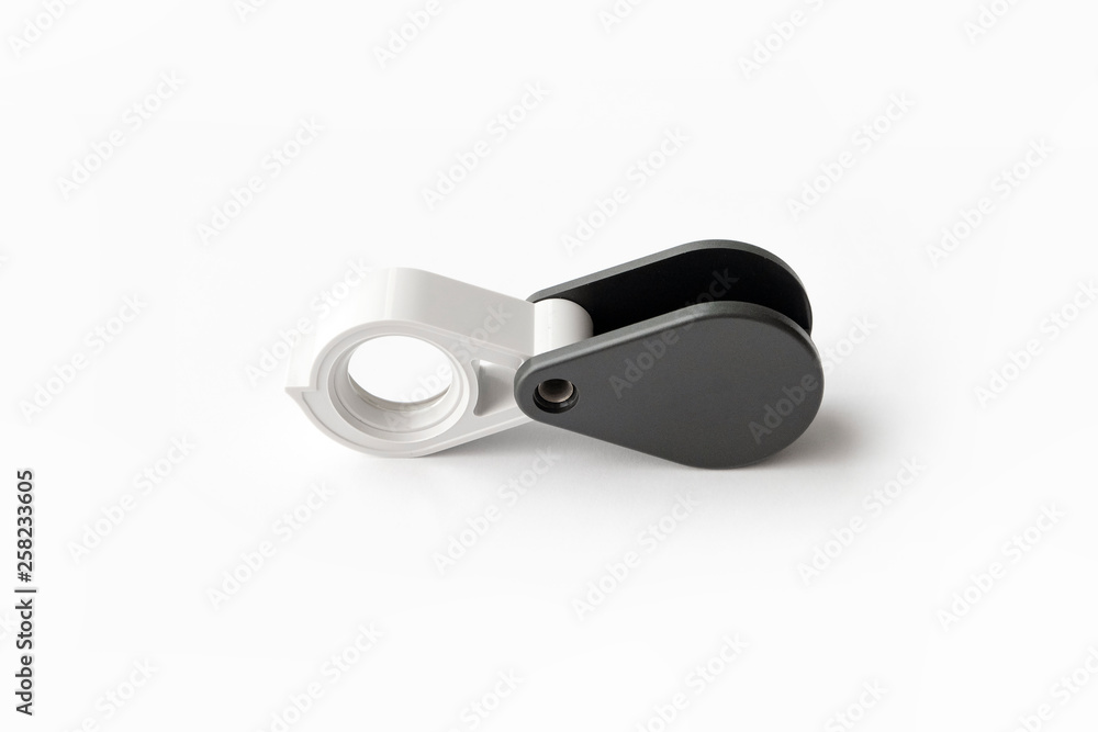 Magnifying glass for diamonds or see the amulet Isolated on a White Background. Magnifying glass for diamonds or see the amulet Isolated on a White Background.