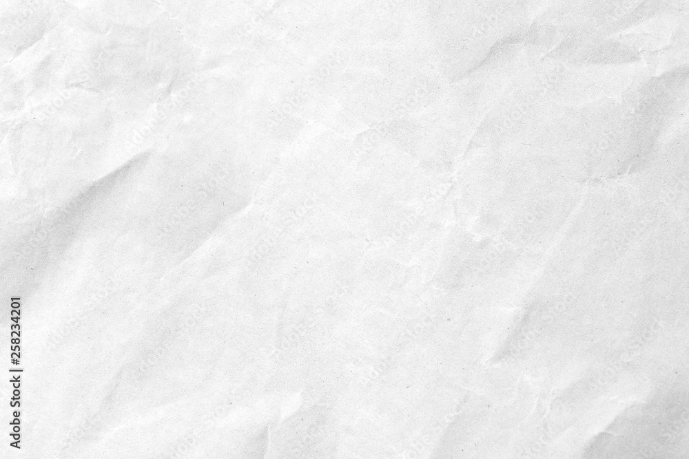 Fototapeta premium White crumpled paper texture background. Close-up.