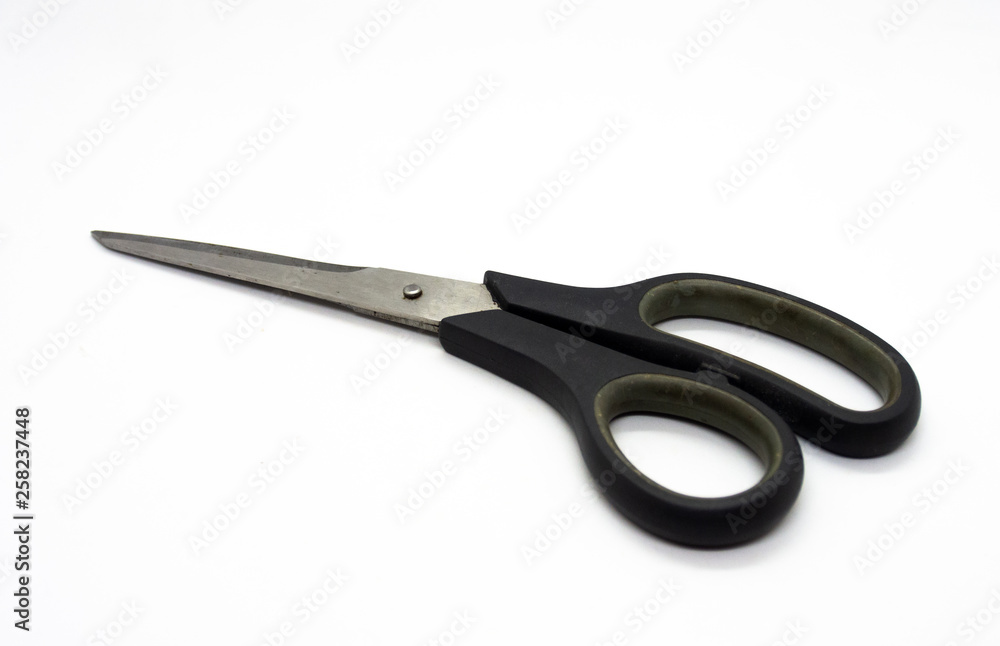 Old scissors are used for cutting various thin materials isolated on White background. Old scissors are used for cutting various thin materials isolated on White background.