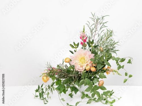 Wispy boho flower arrangement with dahlia and ranunculus