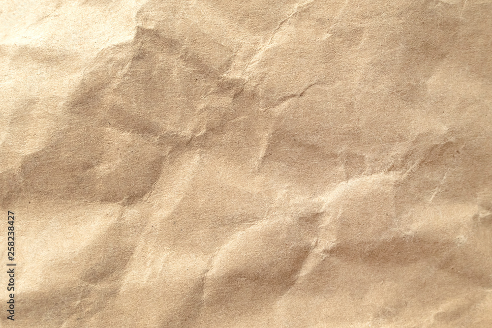 Fototapeta premium Brown crumpled paper texture background.