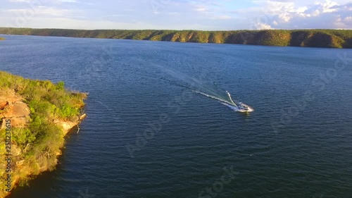 Drone record a boat at river in sunset time - Piranhas, Brazil