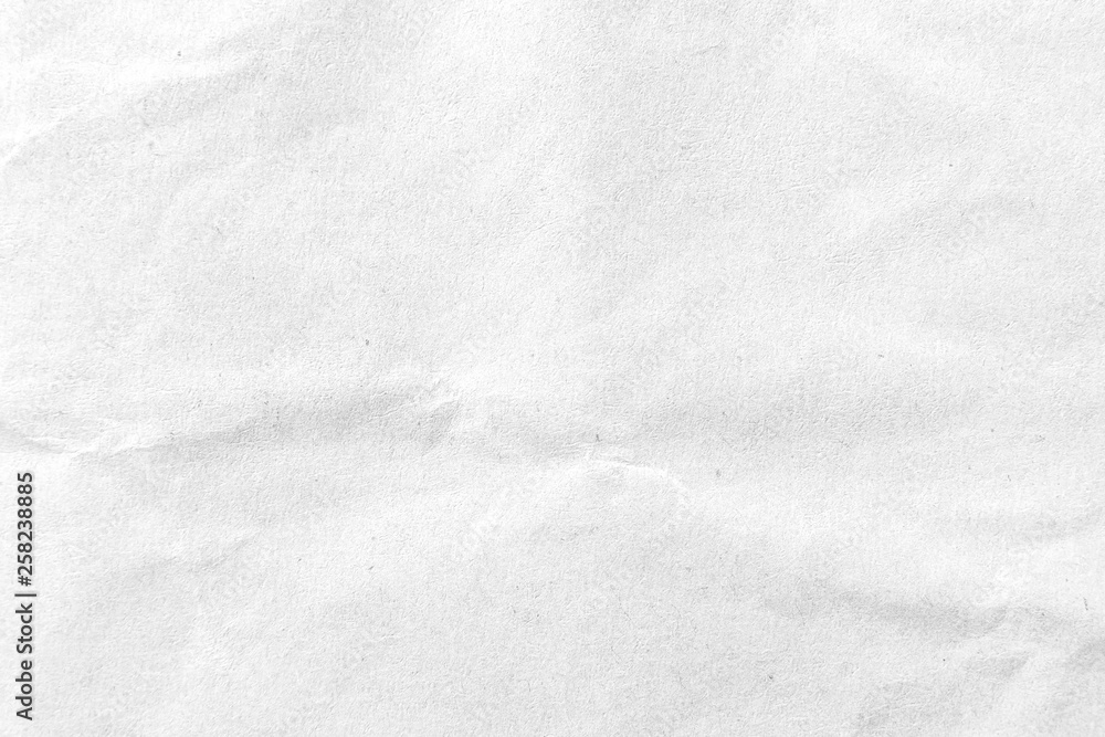 Fototapeta premium White crumpled paper texture background. Close-up.