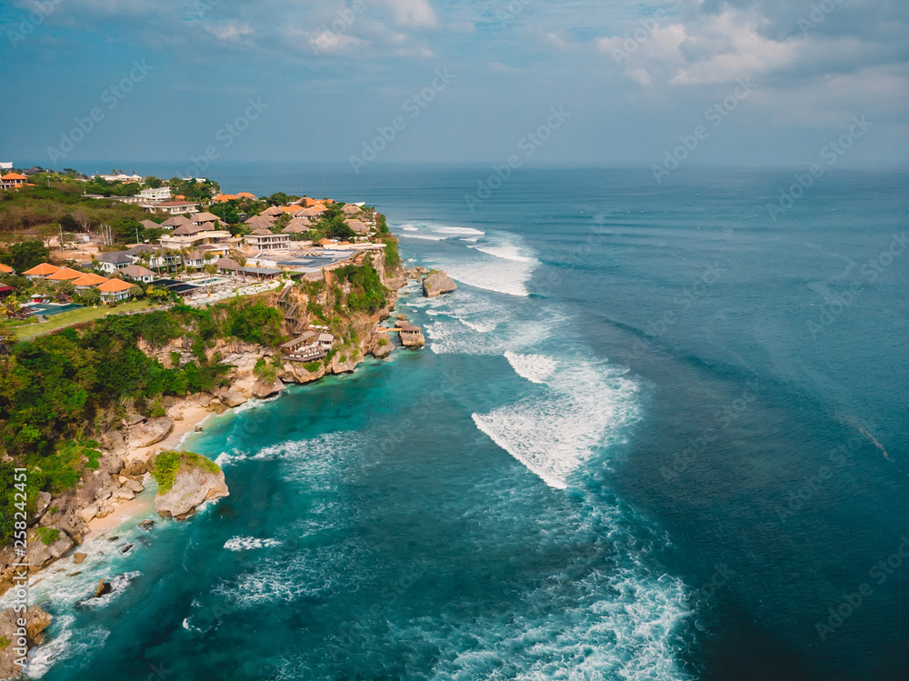 Beautiful cliff in Uluwatu and turquoise ocean in Bali, aerial shot