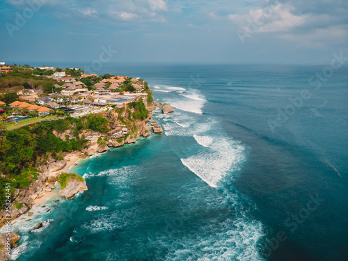 Beautiful cliff in Uluwatu and turquoise ocean in Bali, aerial shot