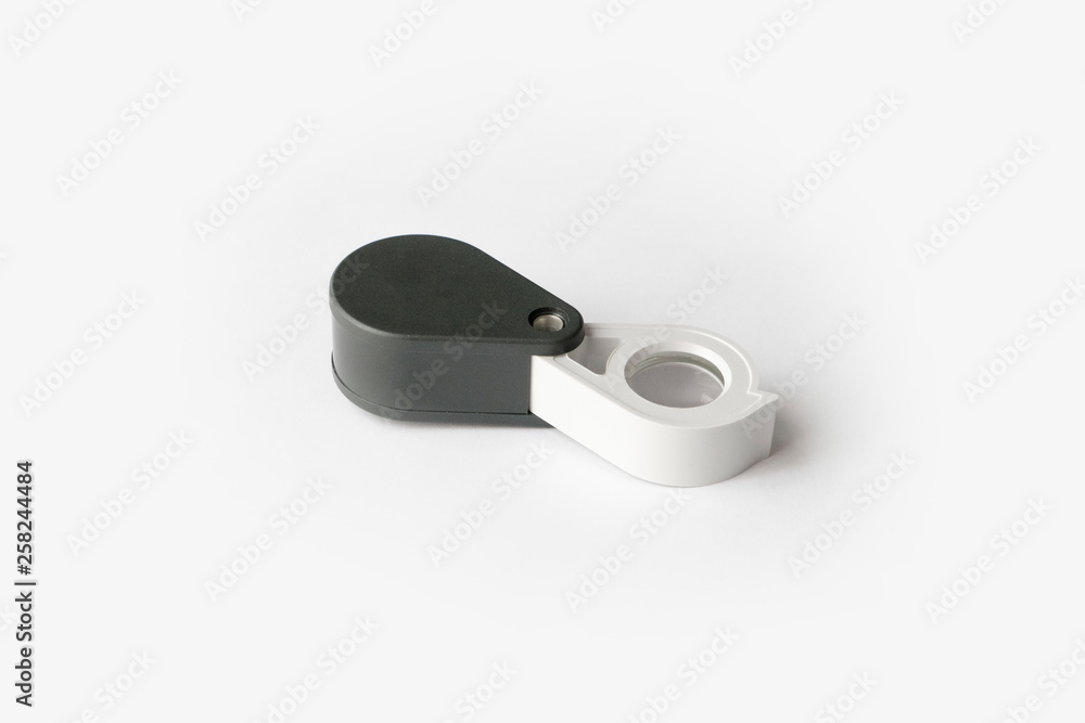 Magnifying glass for diamonds or see the amulet Isolated on a White Background. Magnifying glass for diamonds or see the amulet Isolated on a White Background.