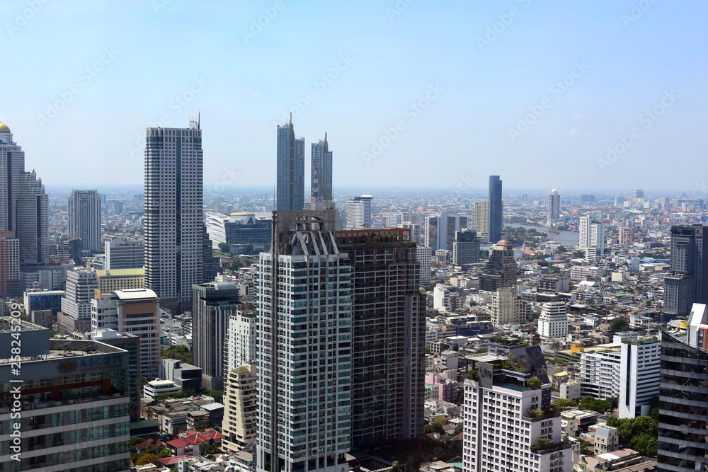 High-rise buildings and offices in the big city business district Bangkok with both large buildings and public transportation systems