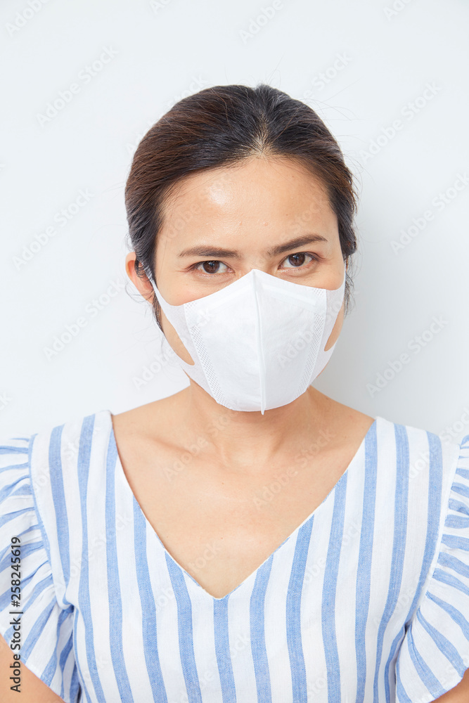 Asian woman wearing face mask Asian woman wearing face mask