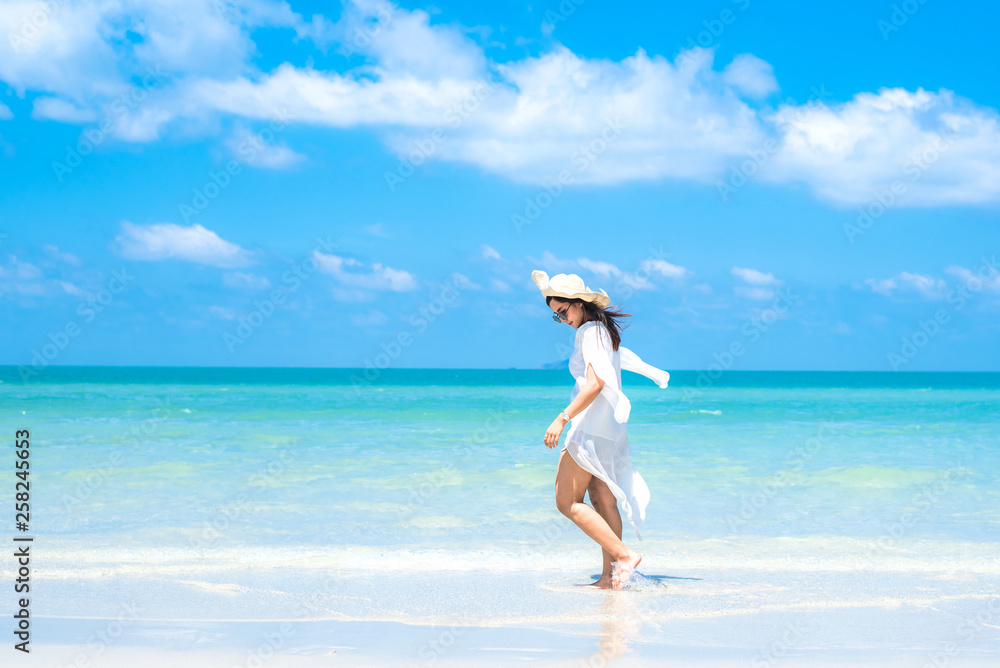 Woman in the ocean with blue sky Woman in the ocean with blue sky
