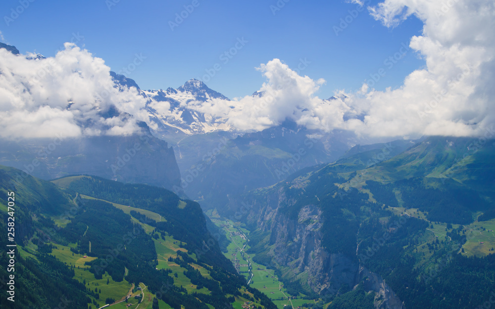 Alpine peaks landskape. Lauterbrunnen, Jungfrau, Bernese highland. Alps, tourism, journey, hiking concept. Alpine peaks landskape. Lauterbrunnen, Jungfrau, Bernese highland. Alps, tourism, journey, hiking concept.