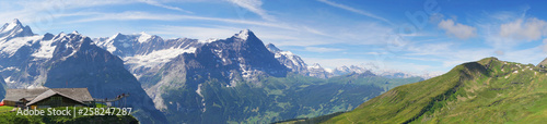 Alpine peaks of Grindelwald and Jungfrau. Landskape background of Bernese highland. Alps  tourism  journey  hiking concept.