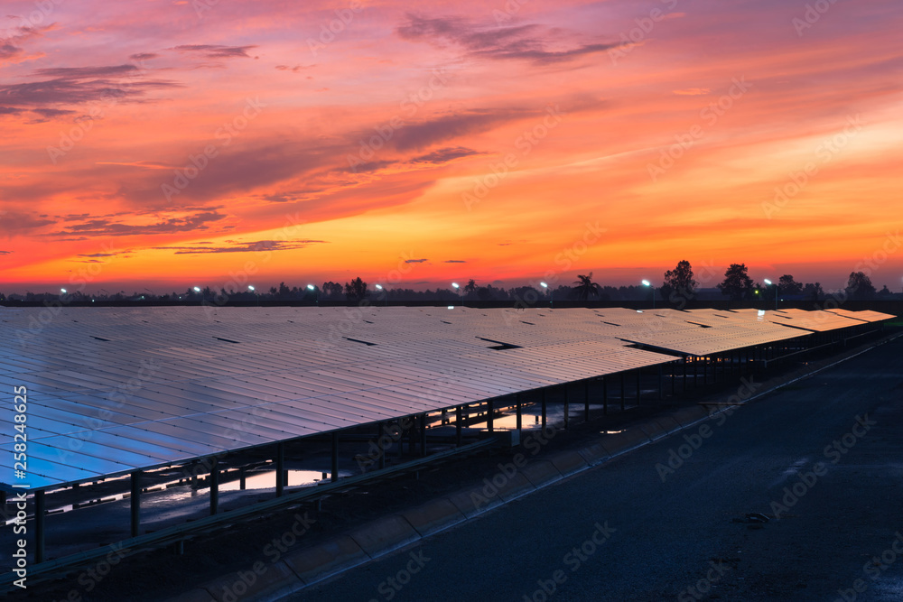 Photovoltaic solar power plant in the morning sunrise