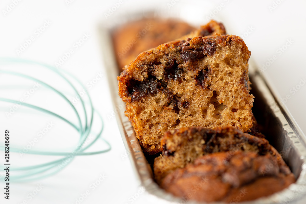Delicious chocolate banana cake on white background. Selective focus Delicious chocolate banana cake on white background. Selective focus